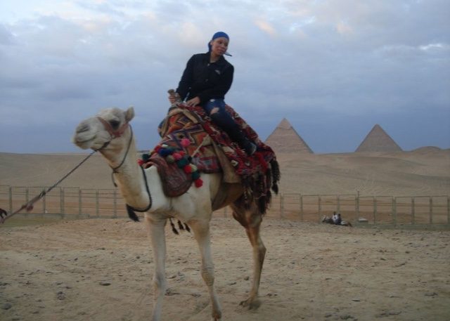 Gene on camel at the Pyramids of Giza, Egypt